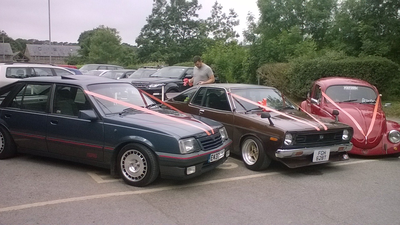 Cars lined up outside the workshop
