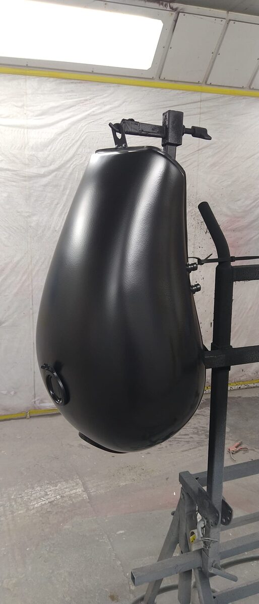 Motorcycle tank in primer, prepared for paint